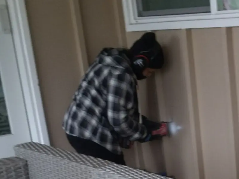 Professional electrician installing an exterior outlet in Black Diamond