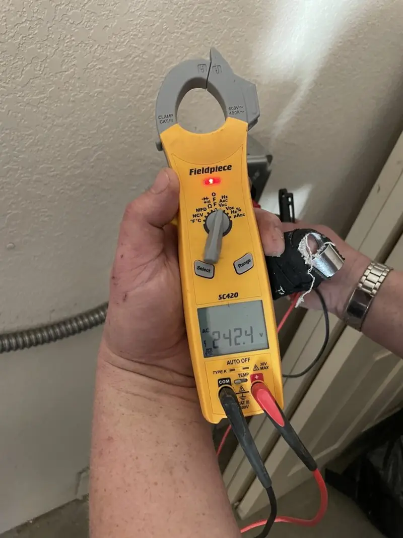Voltage testing with clamp meter during Electrical Installation Services in Black Diamond